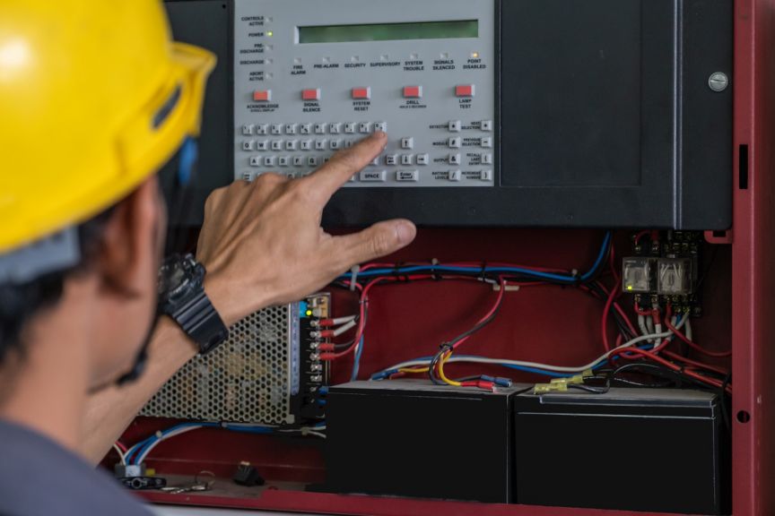 technician Checking doing work Maintenance fire alarm system in a factory Fire protection Factory safety Qiao Shan; Shutterstock ID 1303768399; Purchase Order: purchase_order